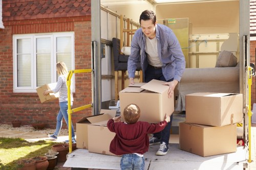 Packed boxes and furniture showing a load-based removals estimate