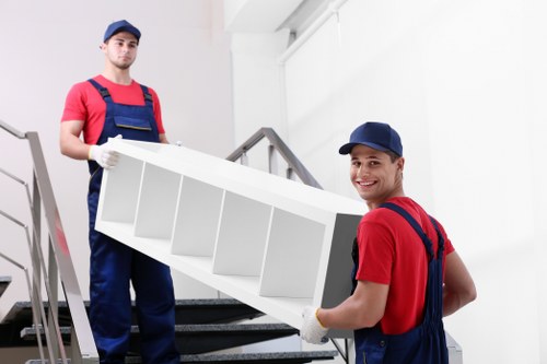 Loading furniture into a van on a Todenmark residential street
