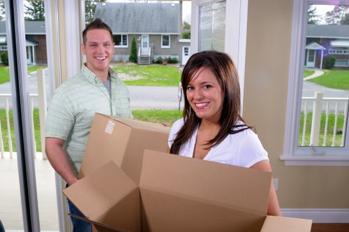 Local packing team preparing household items for a move in Todenmark