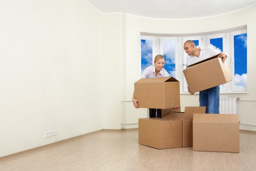 Furniture and boxes being moved by a man and van team
