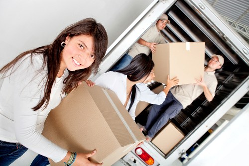 Local moving team preparing boxes for an apartment move in Todenmark