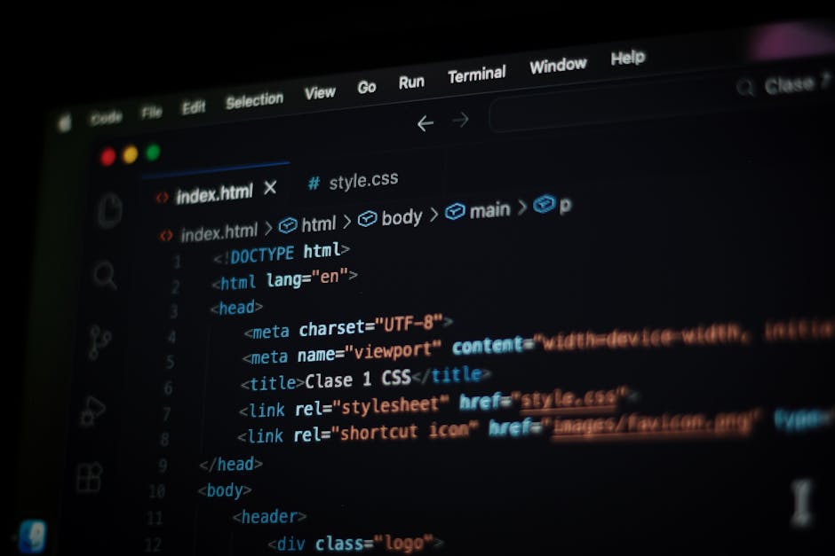 A close-up view of a laptop computer displaying lines of code in a text editor, situated on a wooden surface. Next to the laptop, there is a coffee mug with a beige background and black text that read